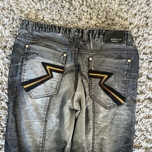 Black faded Men's baggy Brooklyn Xpress jeans with yellow and black pocket logo